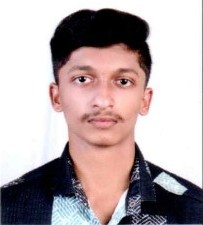 Portrait of a woman with dark hair and green leaves background